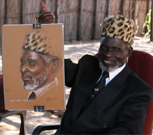 Artist Nafisa Naomi is drawing the Hon Chief Mayuni on site in Africa
