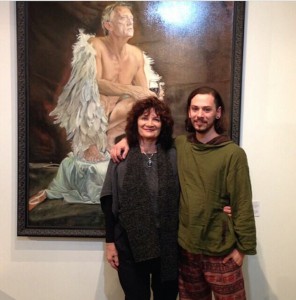 Mertim with Janis lander at the opening of his exhibition “Feathers and Kisses” i in front of his portrait of "The Red Shoe" - Simon Burke